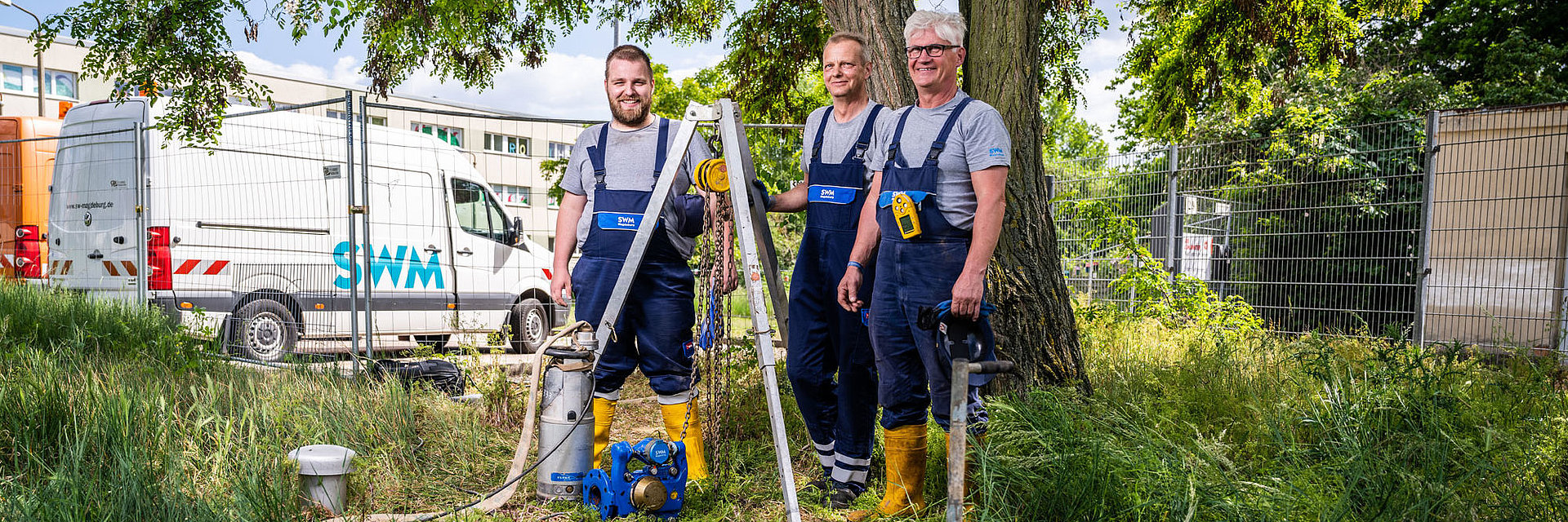 Drei SWM Mitarbeiter aus dem Bereich Wasser 