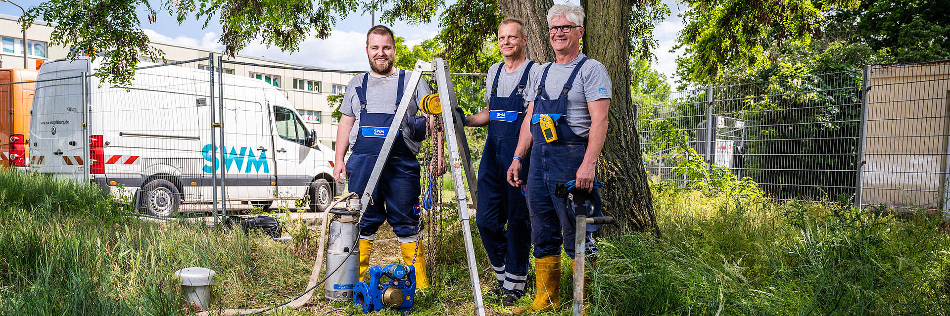 Drei SWM Mitarbeiter aus dem Bereich Wasser 